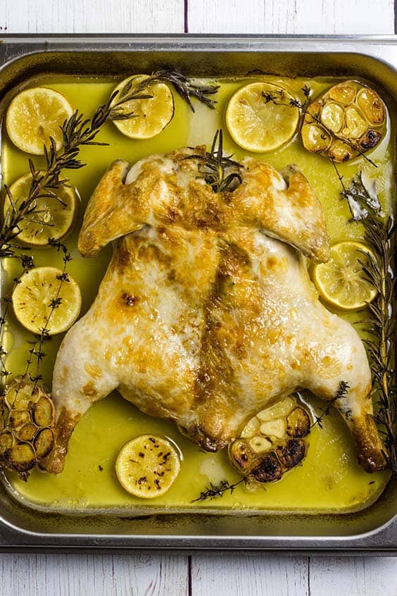 a flattened roast chicken with lemon and herbs