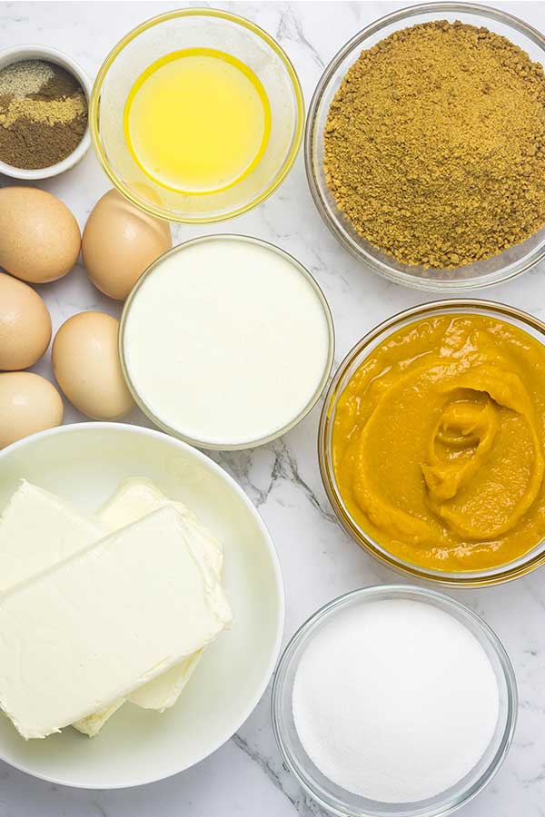 various individual bowls with ingredients measured out in them on a marble counter top