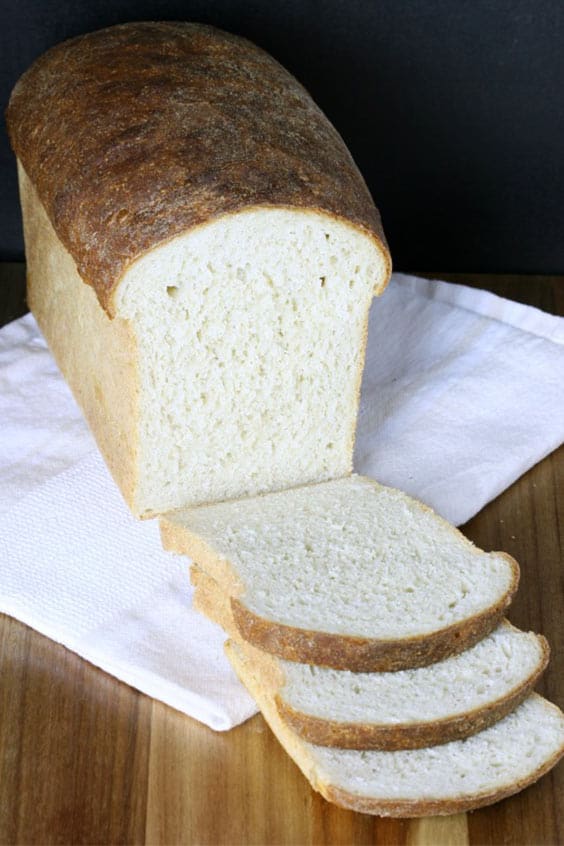 sliced loaf of honey oat sandwich bread, baked in a steam oven