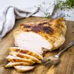 succulent sous vide turkey breast sliced on a chopping board