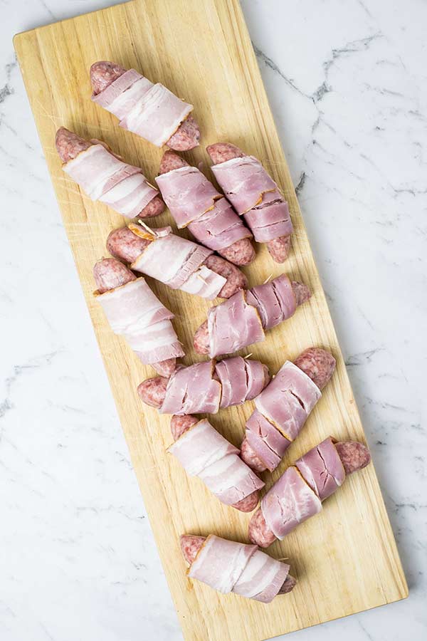 raw bacon wrapped sausages