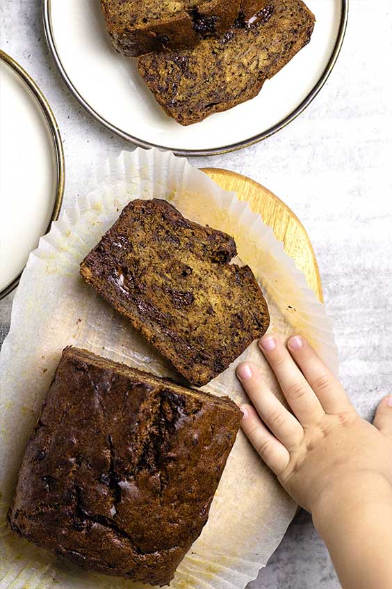 choc chunk banana bread with cheeky hand