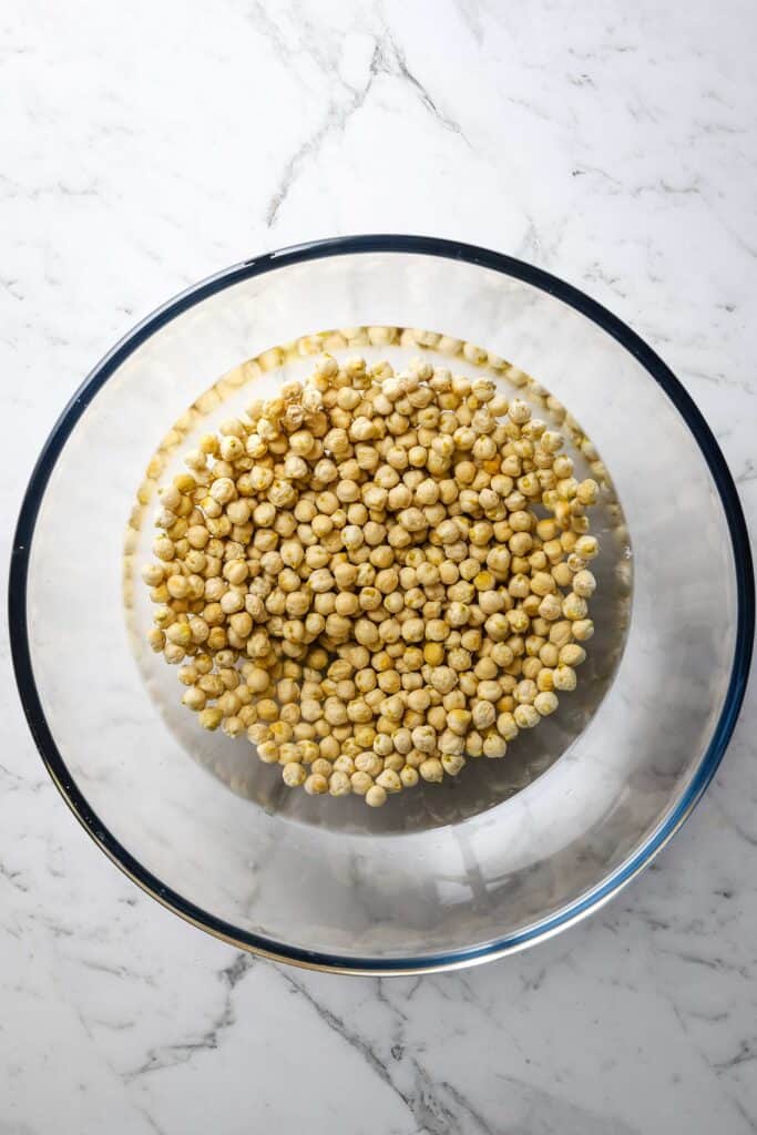 dried chickpeas covered with water for soaking
