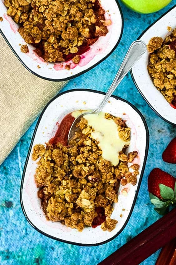 apple, rhubarb and strawberry crumble in an enamel baking dish