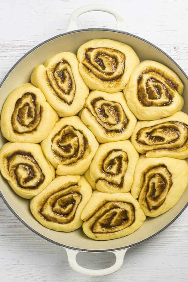 cinnamon rolls in a cast iron baking dish