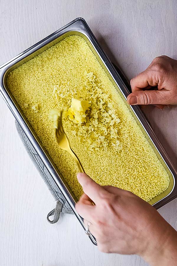 freshly steamed couscous with butter on top