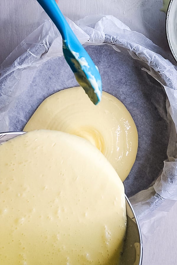 basque cheesecake batter being poured into 