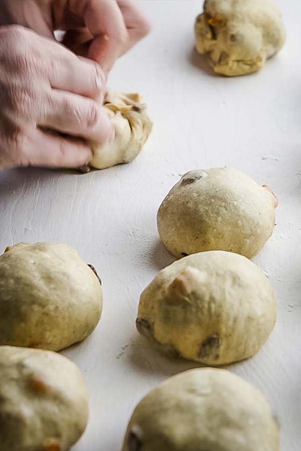 forming dough into round buns