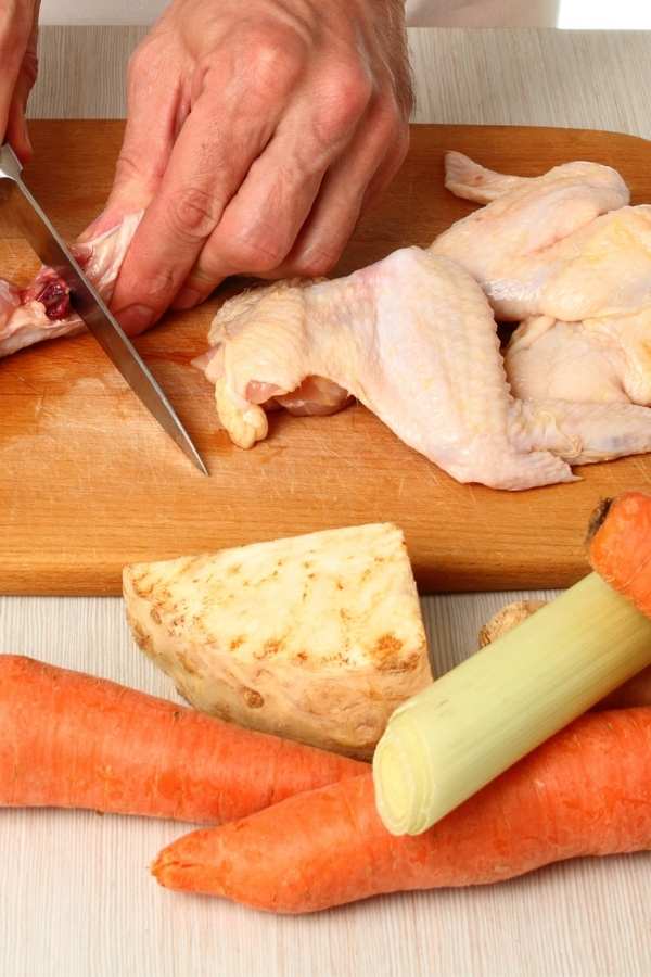 cutting chicken for stock