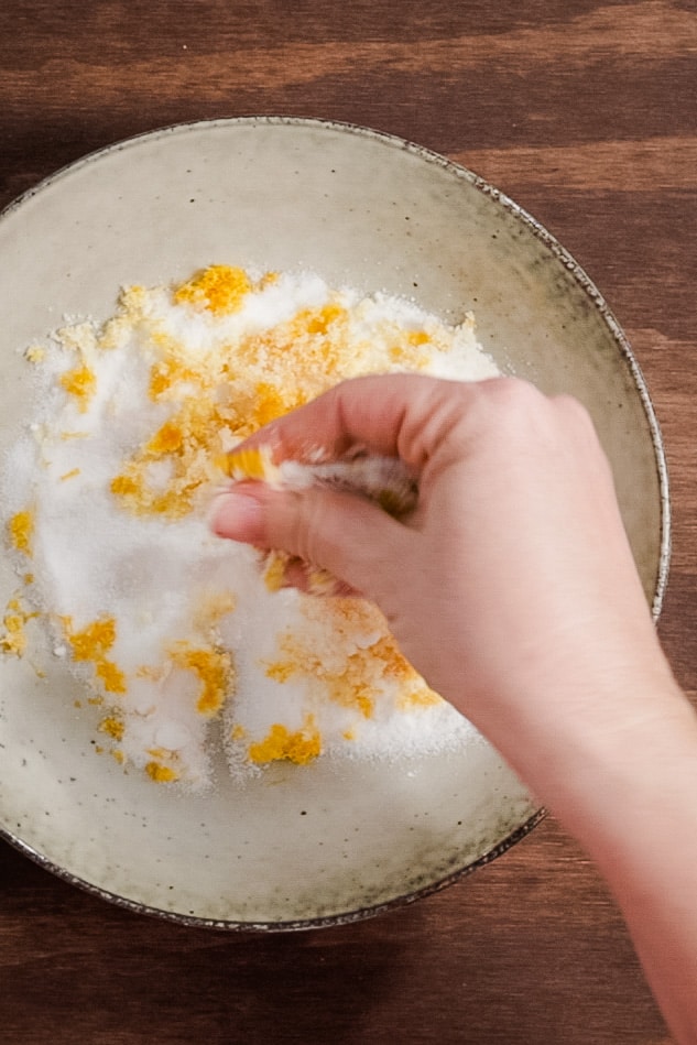 lemon zest being rubbed into sugar