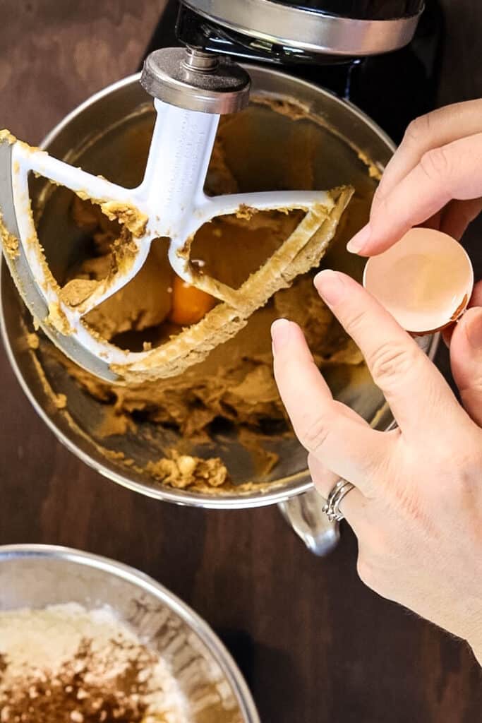 Adding eggs to butter and sugar mixture