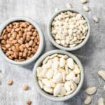 Three bowls of dried beans prepared for cooking in a steam oven.