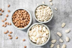 Three bowls of dried beans prepared for cooking in a steam oven.