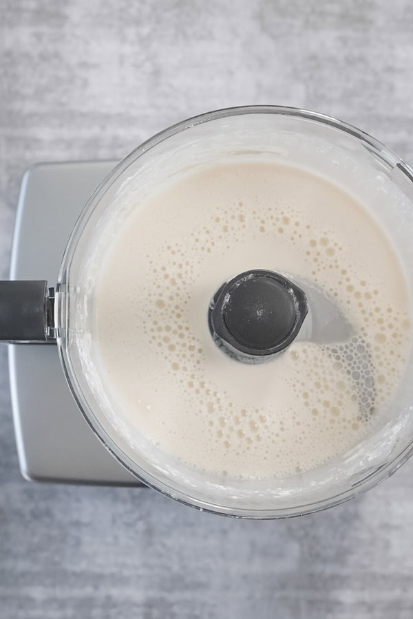 Blended Dutch Baby Pancake batter in a food processor.