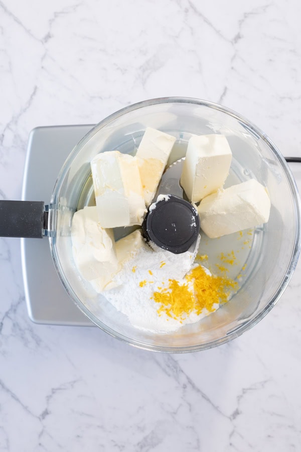Cream cheese, lemon zest, and sugar in a food processor.