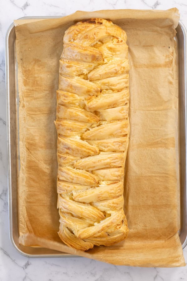 Golden baked lemon cheesecake Danish on a tray.