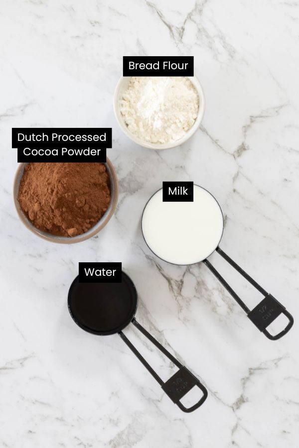 Ingredients for tangzhong, the starchy paste used for milk bread dough. Cocoa, flour, milk, water.