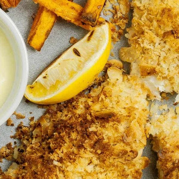 Steam oven almond crumbed fish with sweet potato chips, lemon wedge and mayo