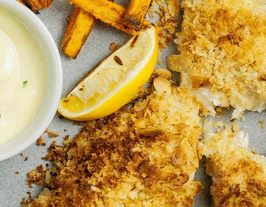 Steam oven almond crumbed fish with sweet potato chips, lemon wedge and mayo