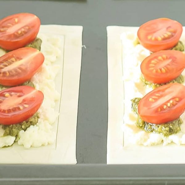 Cherry Tomato Tarts Landscape Web 2 raw puff pastry cherry tomato tarts on a baking tray