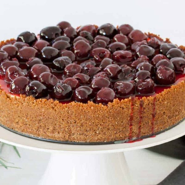 cherry cheesecake with ginger crumb crust and cherry sauce