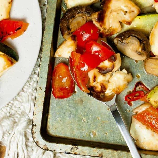 Mediterranean vegetables and halloumi baked on an oven tray