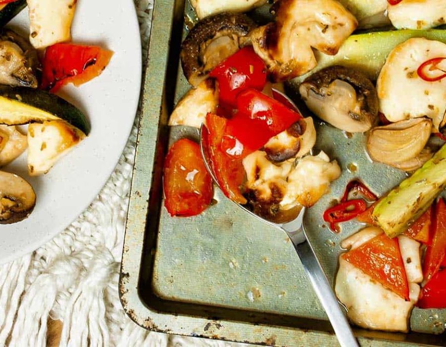 Mediterranean vegetables and halloumi baked on an oven tray