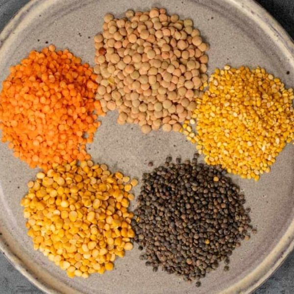 a plate with colorful lentils of different kind