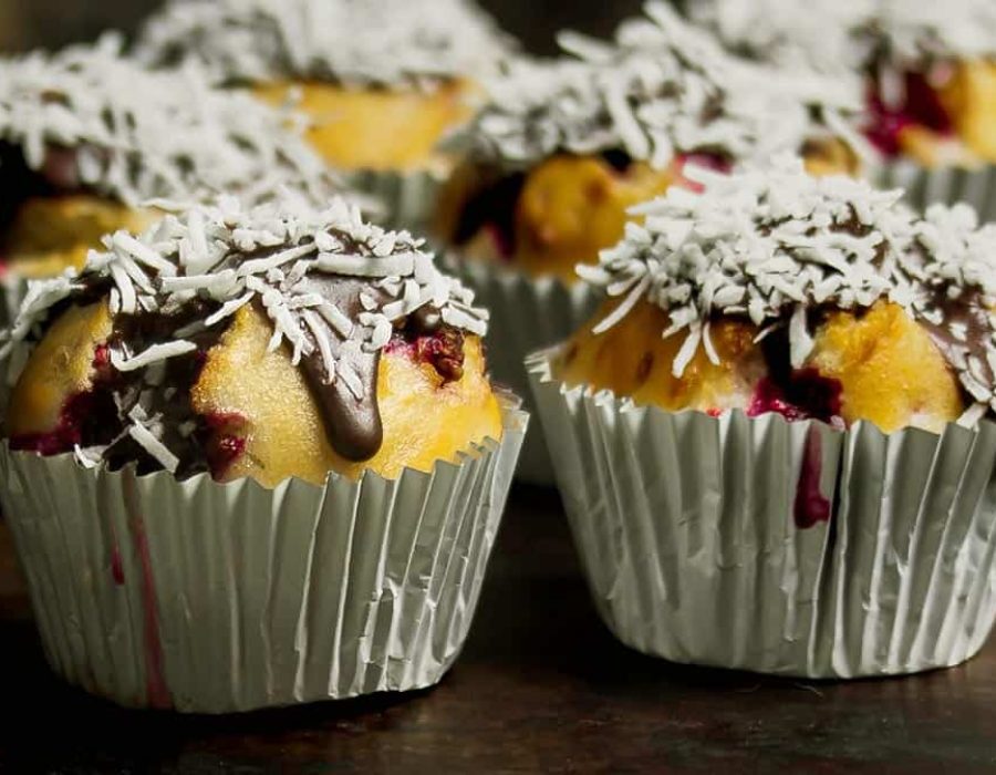 zoomed in image of two muffins of a batch of raspberry Lamington muffins