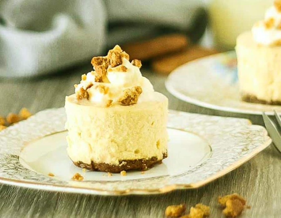 an individual malted vanilla cheesecake on a gold rimmed plate