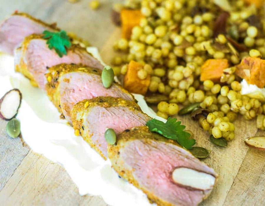 Slices of lamb loin on a bed of yoghurt with Moroccan couscous