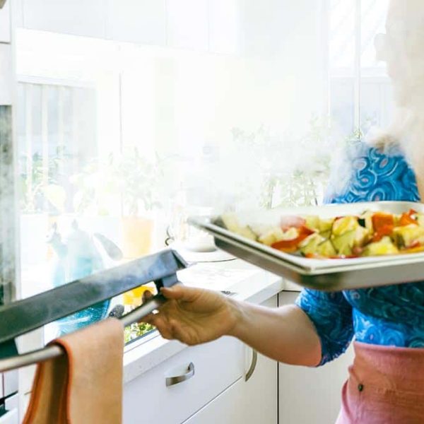 woman opening steam oven