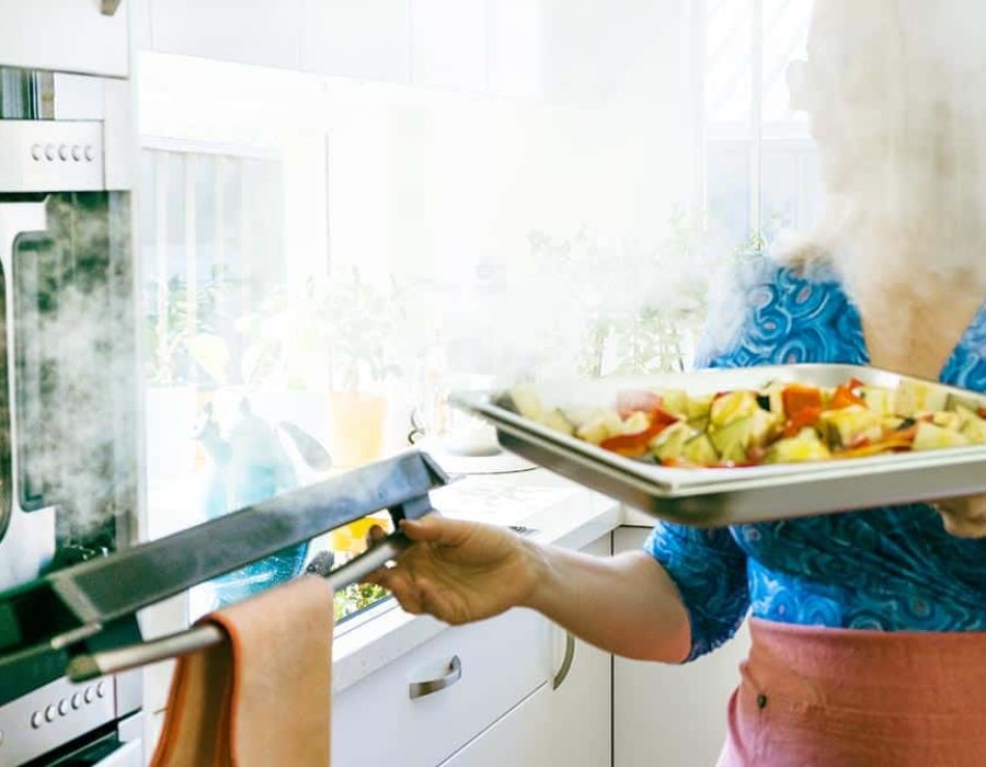 woman opening steam oven