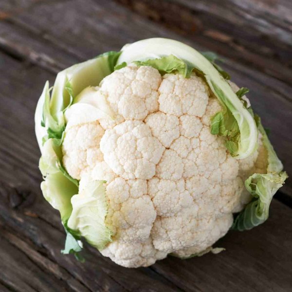 Beautiful and yummy cauliflower on an old wooden table